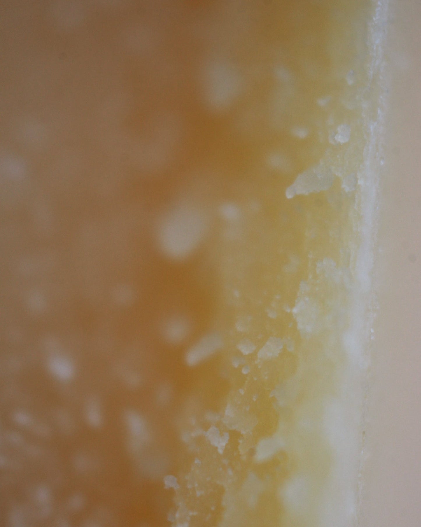 A close up micro shot of the luxury soy wax blend, showing the delicate texture.