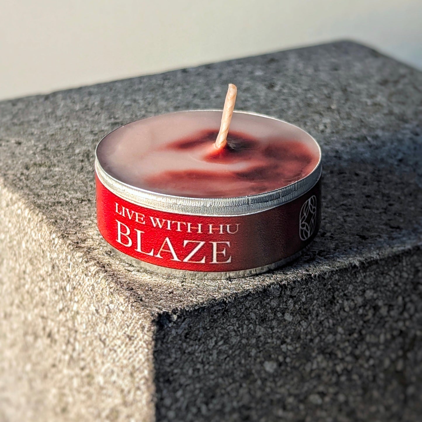 Single tealight candle in signature scent - blaze. Red roses and firewood inspired. passionate love