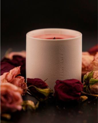 Blaze candle sitting in the middle of a variety of roses, quietly, waiting to be lit. Like a heart filled with love, waiting to burn with every last drop of passion.