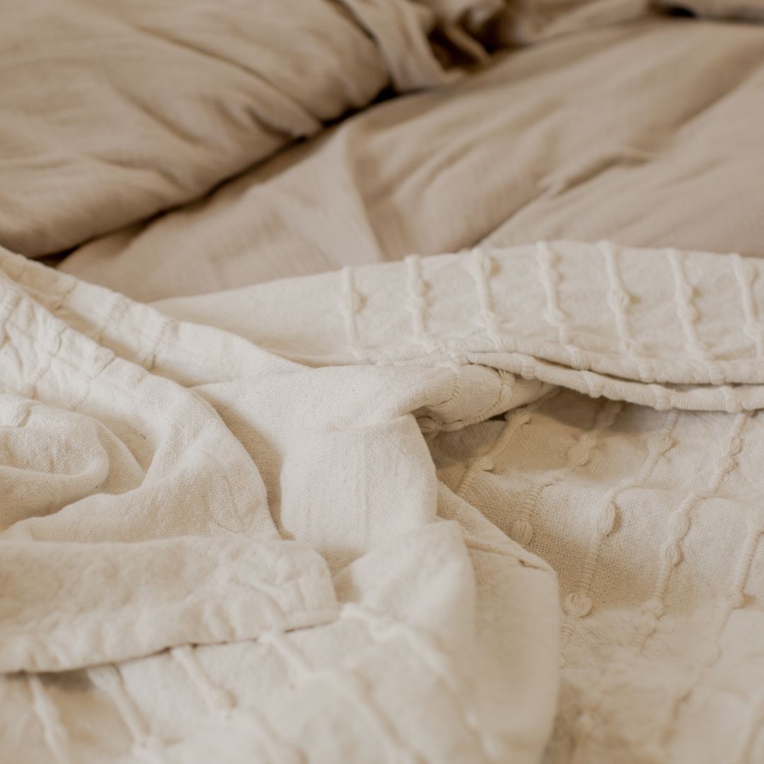 Clean and refreshing linen casually folded, presenting a sense of maximum comfort, cleanness, and resting.